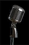 Retro microphone isolated on the black background