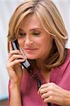 Consultant phoning client from surgery with good news