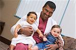 Consultant holding two IVF conceived children
