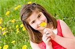 Cute Little Girl Smelling a Dandelion