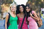 Group of three female friends having fun off campus