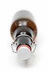 Bottle of beer. White background. Shallow depth of field.