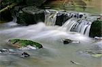 Small waterfall in a mountain stream taken with a slow shutter speed