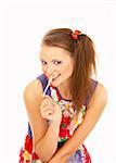 The attractive young girl plays with a chewing gum on a white background