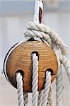 Close-up of a vintage sailboat: wooden tool and ropes