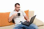 casual man sitting on sofa with laptop