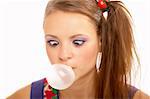 The amusing girl has become cross-eyed, looking on the inflated bubble, on a white background