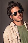 Portrait of young hispanic male beauty wearing fashion sunglasses
