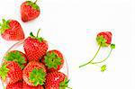 High key photo of fruit dish filled with nice red strawberries