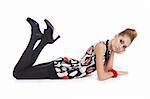 Fashion dressed beautiful girl lying on the floor