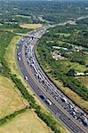 Helicopter aerial shot of traffic congestion on the M25 motorway around London, England