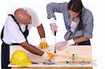 construction workers at work on white background