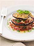 Plate of Aubergine Parmigiana Tower with Herb Oil