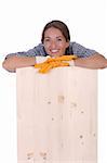 woman carpenter holding wooden plank on white background