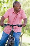 Senior man on cycle ride in countryside