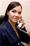 attractive brunette businesswoman in office