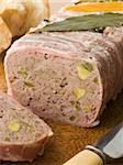 Pate Campagne on a Chopping Board with Rustic Bread