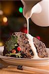 Portion of Christmas Pudding with Pouring Cream