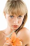 nice blond woman with lomg hair and a flower in orange color in her hand