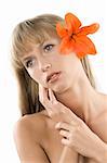 fresh and beautiful portrait of a woman with an orange lily