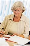 Senior woman studying on campus