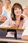 Female adult student listening to a university lecture