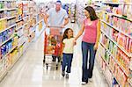 Family grocery shopping in supermarket