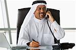 A Middle Eastern businessman talking on the telephone