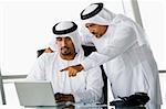 Two Middle Eastern businessmen looking at a computer