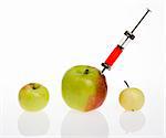 GMO - genetic modified food concept. Big apple with syringe.