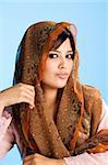 beautiful Muslim young woman in head scarf and traditional wear