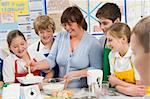 Schoolchildren and teacher at school in a cooking class