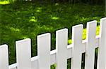 White fence around front yard of residential house