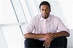 Businessman sitting in office lobby