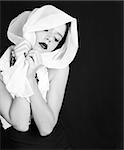 Beautiful Woman Dressed in Retro Vintage Style With Scarf on Her Head in Black and White