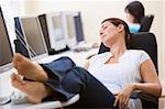 Woman in computer room sleeping