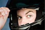 Close-up of a man wearing a motorcycle helmet