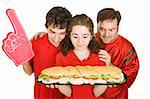 Hungry people at a football party, looking at a giant submarine sandwich.  Isolated on white.