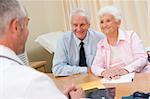 Couple in doctor's office smiling