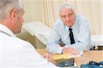 Man in doctor's office frowning