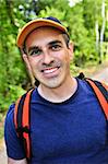 Portrait of happy middle aged man on a forest trail