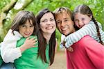 Family outdoors smiling