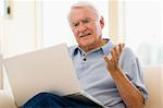 Man in living room with laptop