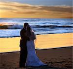 Couple wedding on the beach at sunset