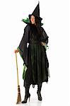 nice woman in green and black witch dress with broom and hat
