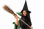 close up of a cute witch with hat playing with a broom