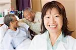 Nurse Smiling In Hospital Room