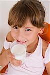 smiling girl with glass of milk