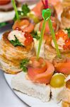 delicious seafood canapes with salmon and red caviar