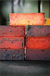 piles of hot iron blocks in foundry. Narrow focus on central block